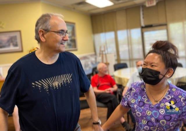 A Daycation for Seniors staff member caring for a member